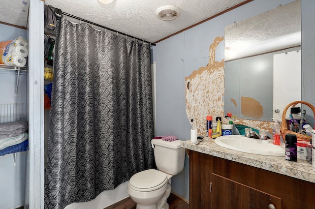 full bathroom with a textured ceiling, toilet, vanity, curtained shower, and ornamental molding