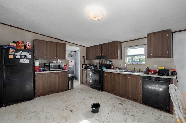 kitchen featuring black appliances, light countertops, under cabinet range hood, dark brown cabinetry, and vaulted ceiling