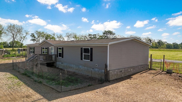 manufactured / mobile home with crawl space and fence