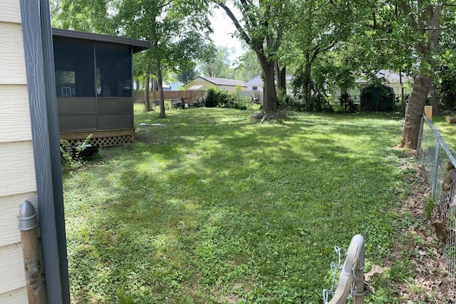 1835 S Franklin Ave, Springfield, MO 65807 - fenced backyard with a sunroom