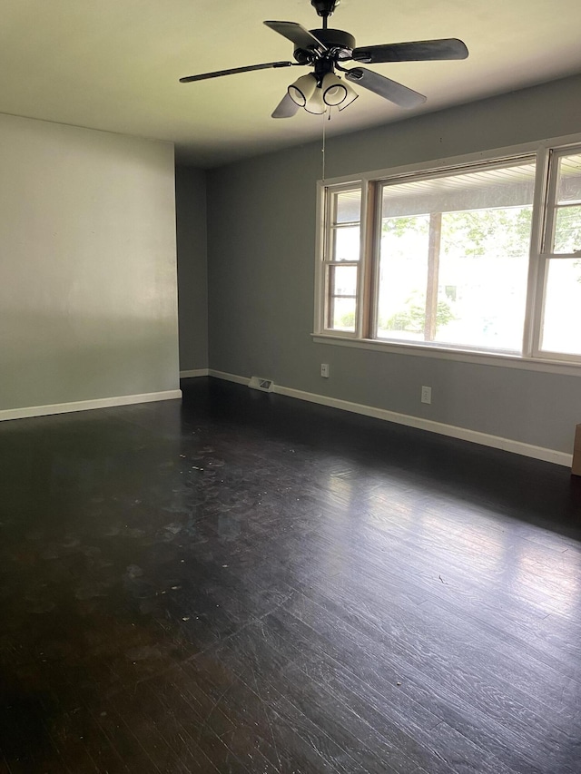 1835 S Franklin Ave, Springfield, MO 65807 - spare room featuring baseboards and a ceiling fan