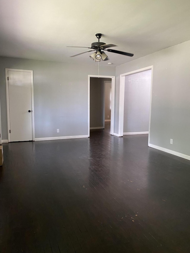 1835 S Franklin Ave, Springfield, MO 65807 - unfurnished room featuring dark wood-style floors and a ceiling fan
