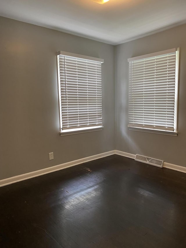 1835 S Franklin Ave, Springfield, MO 65807 - spare room with dark wood-style floors and baseboards