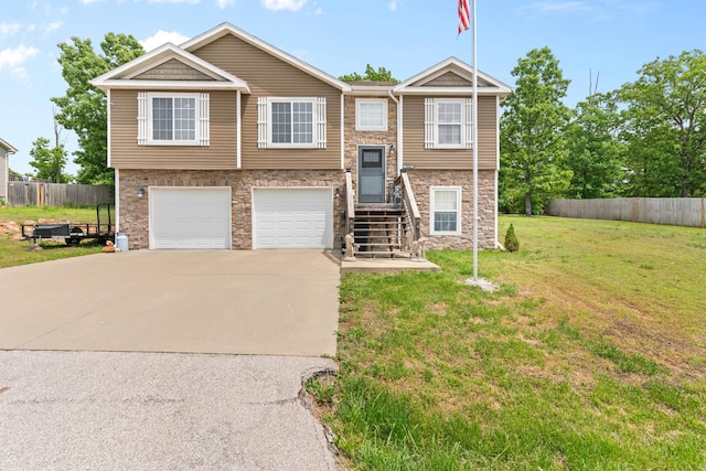 19662 Ladera Rd, Waynesville, MO 65583 - raised ranch featuring driveway, stone siding, and an attached garage