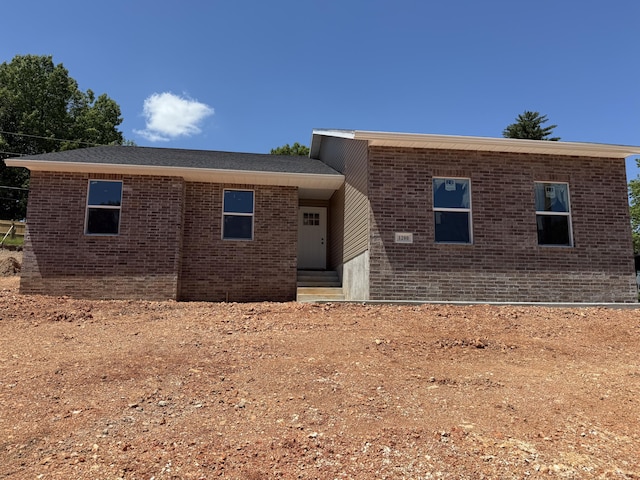 view of front of home with brick siding and entry steps