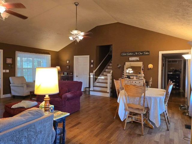 3590 County Road 7140, West Plains, MO 65775 - dining area featuring a ceiling fan, lofted ceiling, wood finished floors, and stairway