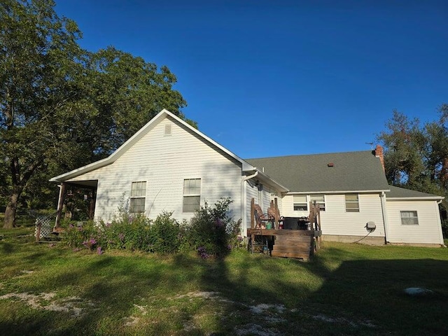 3590 County Road 7140, West Plains, MO 65775 - back of house with a lawn and a wooden deck