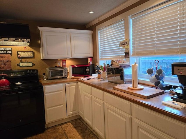 3590 County Road 7140, West Plains, MO 65775 - kitchen featuring black range with electric stovetop, tile counters, white cabinetry, custom exhaust hood, and light tile patterned floors