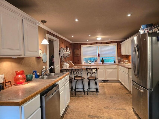 3590 County Road 7140, West Plains, MO 65775 - kitchen featuring appliances with stainless steel finishes, white cabinets, crown molding, a sink, and recessed lighting