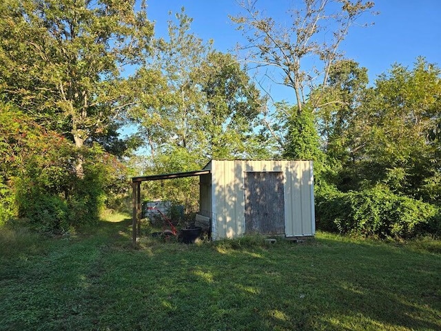 3590 County Road 7140, West Plains, MO 65775 - view of grassy yard featuring a shed, an outdoor structure, and a carport