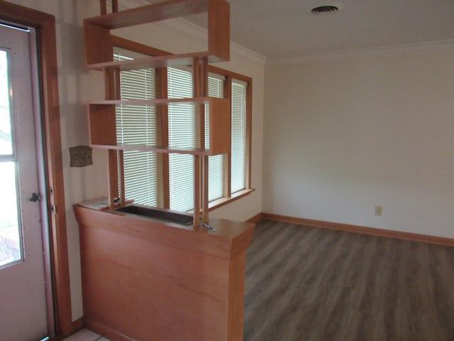 2124 S Kimbrough Ave, Springfield, MO 65807 - entryway featuring ornamental molding, wood finished floors, and baseboards