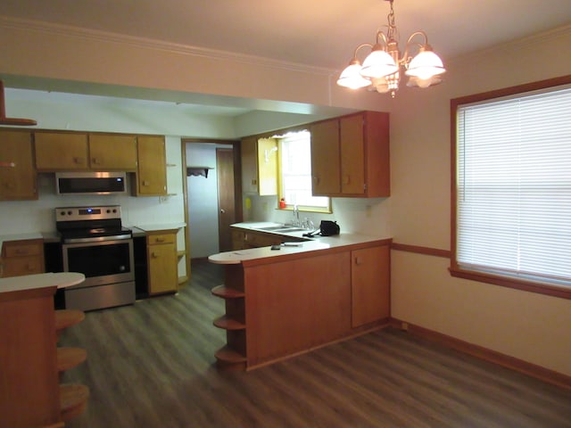 2124 S Kimbrough Ave, Springfield, MO 65807 - kitchen featuring appliances with stainless steel finishes, open shelves, dark wood-style flooring, a peninsula, and light countertops