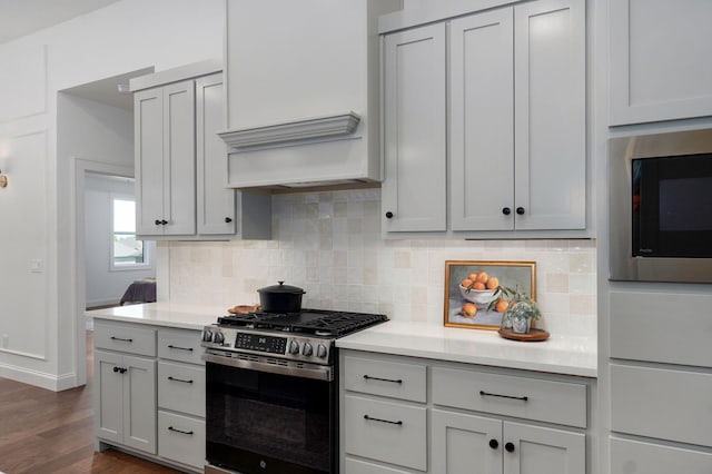 1698 N Marlowe Ave, Springfield, MO 65802 - kitchen with appliances with stainless steel finishes, tasteful backsplash, and light countertops