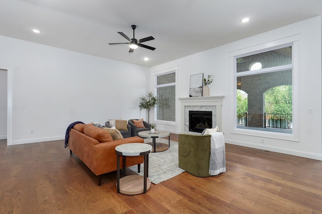 1698 N Marlowe Ave, Springfield, MO 65802 - living room with wood finished floors, ceiling fan, a high end fireplace, baseboards, and recessed lighting