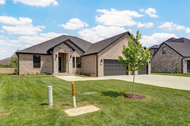 1698 N Marlowe Ave, Springfield, MO 65802 - french country home featuring driveway, an attached garage, brick siding, and a shingled roof