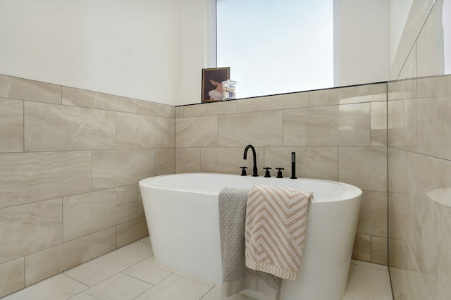 1698 N Marlowe Ave, Springfield, MO 65802 - full bathroom featuring tile walls, a freestanding bath, and tile patterned floors