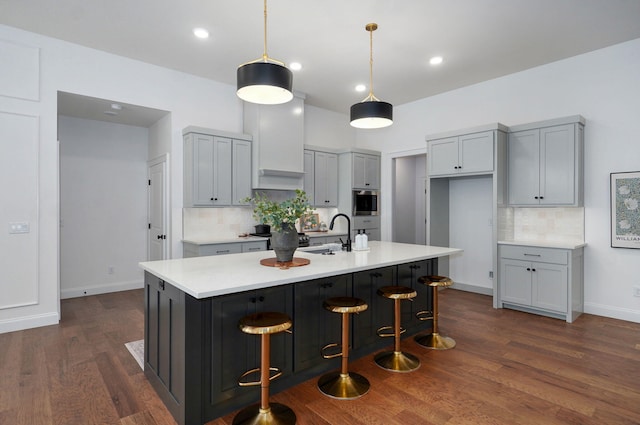 1698 N Marlowe Ave, Springfield, MO 65802 - kitchen with a sink, tasteful backsplash, dark wood-style flooring, light countertops, and recessed lighting