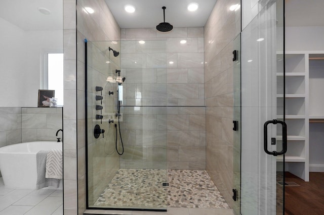 1698 N Marlowe Ave, Springfield, MO 65802 - full bathroom featuring a stall shower, a soaking tub, and a walk in closet