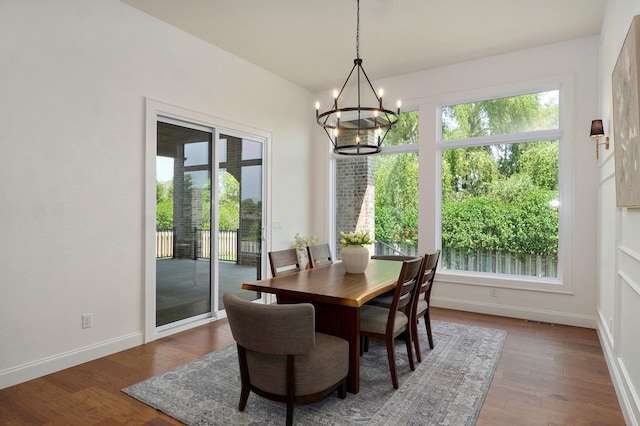 1698 N Marlowe Ave, Springfield, MO 65802 - dining room with a chandelier, baseboards, and wood finished floors
