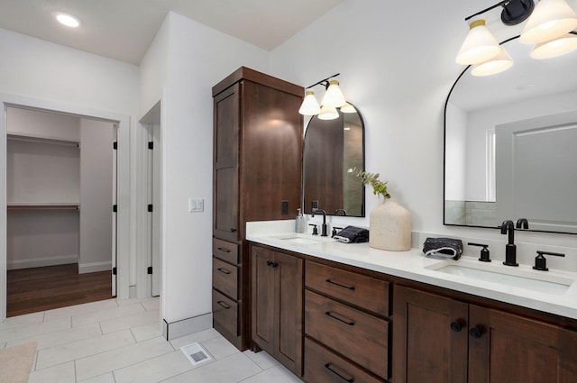 1698 N Marlowe Ave, Springfield, MO 65802 - bathroom featuring double vanity and tile patterned floors