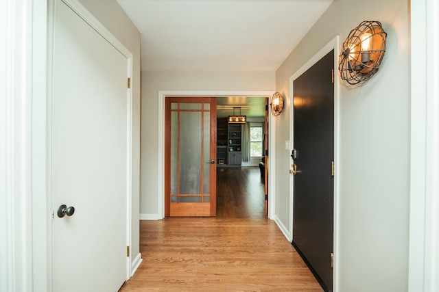 5724 E Mill St, Springfield, MO 65802 - hallway featuring light wood-type flooring and baseboards