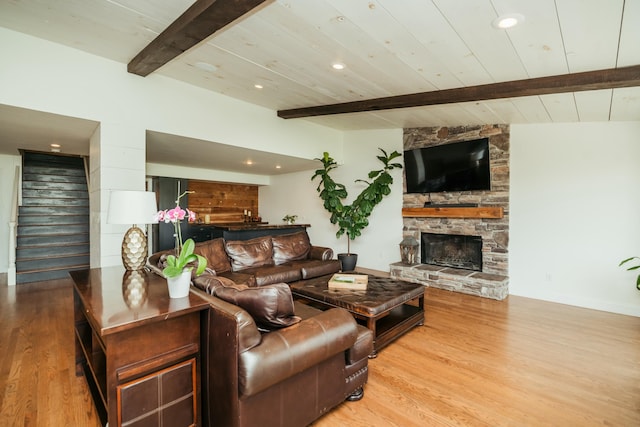 5724 E Mill St, Springfield, MO 65802 - living room with stairs, beam ceiling, wood finished floors, baseboards, and a fireplace