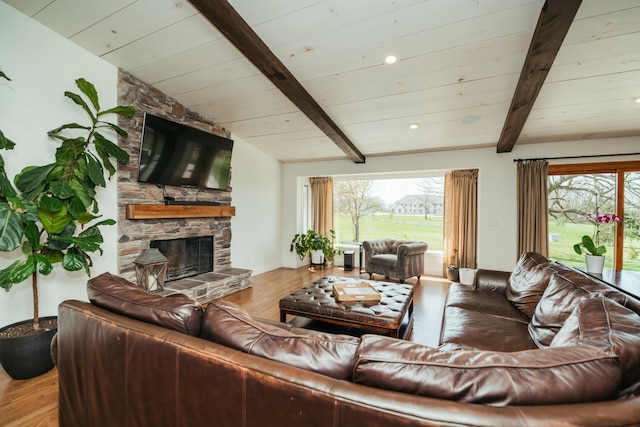 5724 E Mill St, Springfield, MO 65802 - living area featuring wood finished floors, a fireplace, healthy amount of natural light, wooden ceiling, and baseboards