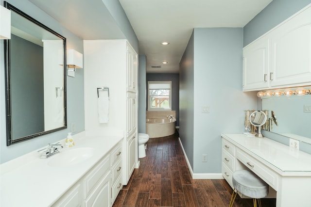 5724 E Mill St, Springfield, MO 65802 - full bath with recessed lighting, a tub to relax in, wood finished floors, baseboards, and vanity