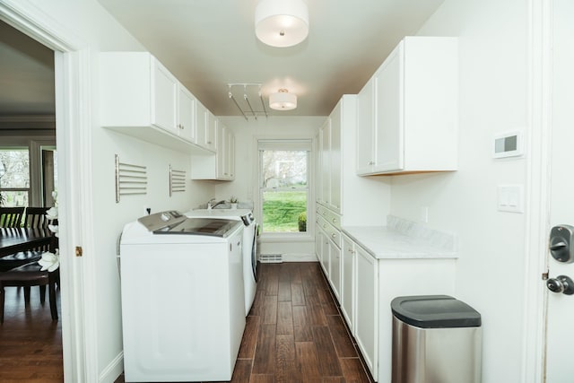 5724 E Mill St, Springfield, MO 65802 - washroom with cabinet space, independent washer and dryer, and dark wood-style floors