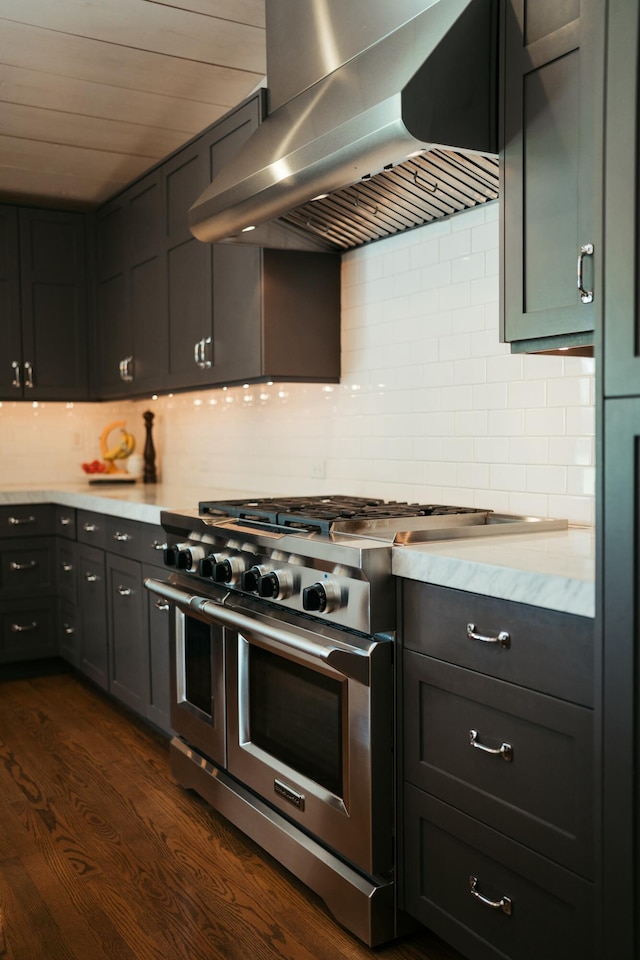 5724 E Mill St, Springfield, MO 65802 - kitchen with range with two ovens, exhaust hood, decorative backsplash, and dark wood-type flooring