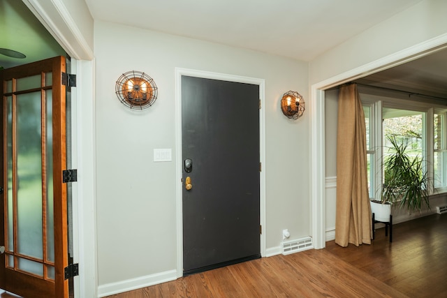 5724 E Mill St, Springfield, MO 65802 - foyer entrance with wood finished floors and baseboards