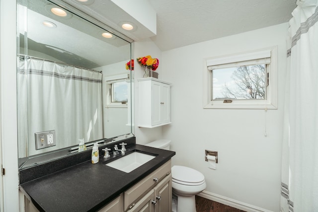 5724 E Mill St, Springfield, MO 65802 - full bathroom featuring toilet, plenty of natural light, vanity, baseboards, and recessed lighting