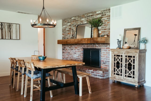 5724 E Mill St, Springfield, MO 65802 - dining space with a chandelier and wood finished floors