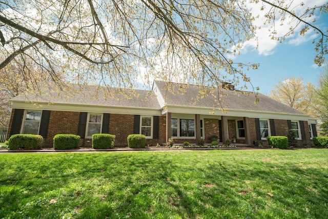 5724 E Mill St, Springfield, MO 65802 - single story home featuring a front yard, brick siding, and a chimney