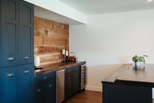 5724 E Mill St, Springfield, MO 65802 - indoor dry bar featuring beverage cooler, refrigerator, dark wood-style flooring, and wood walls