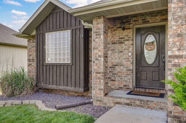 1428 S Appomattox Ave, Republic, MO 65738 - view of exterior entry with board and batten siding and brick siding