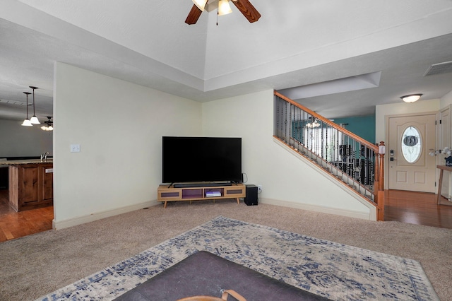 1428 S Appomattox Ave, Republic, MO 65738 - carpeted living area featuring ceiling fan, stairs, baseboards, and a sink