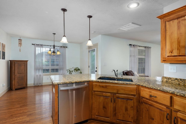 1428 S Appomattox Ave, Republic, MO 65738 - kitchen with stainless steel dishwasher, a sink, wood finished floors, stone countertops, and brown cabinetry