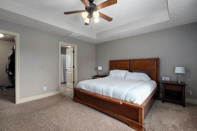 1428 S Appomattox Ave, Republic, MO 65738 - carpeted bedroom featuring baseboards, a tray ceiling, a spacious closet, and a ceiling fan