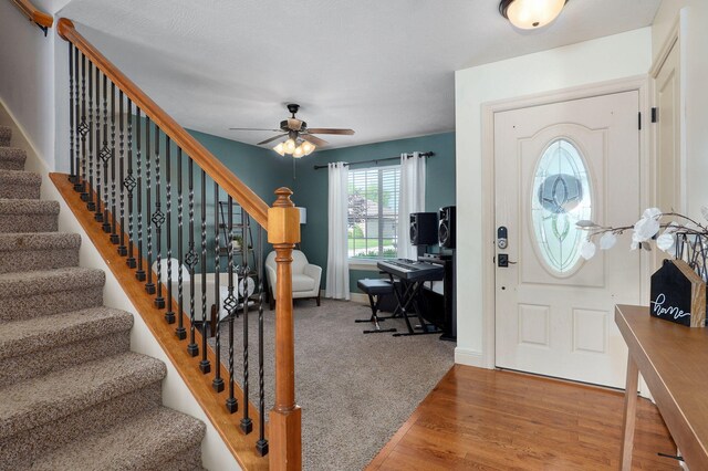 1428 S Appomattox Ave, Republic, MO 65738 - entryway featuring stairway, a ceiling fan, and wood finished floors