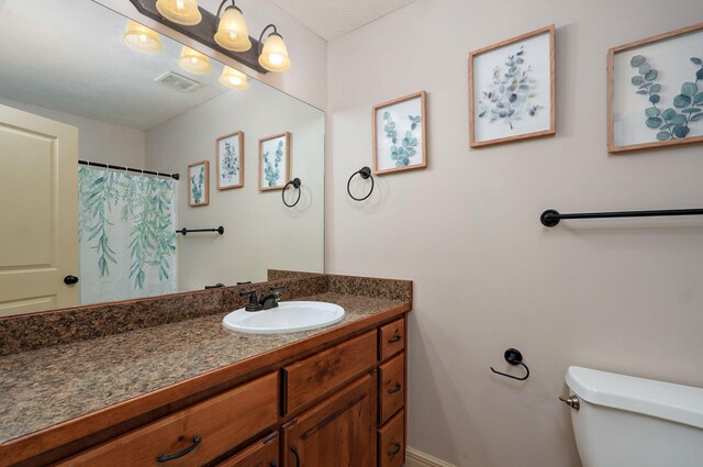 1428 S Appomattox Ave, Republic, MO 65738 - bathroom with vanity, toilet, and baseboards
