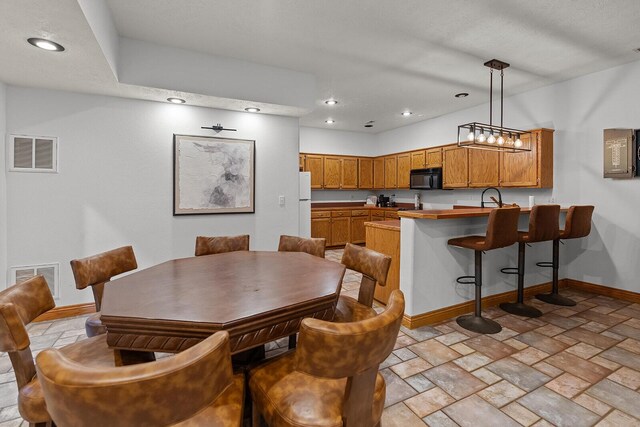 16326 Lawrence Unit 1232, Marionville, MO 65705 - dining space featuring baseboards, light stone finish flooring, and recessed lighting