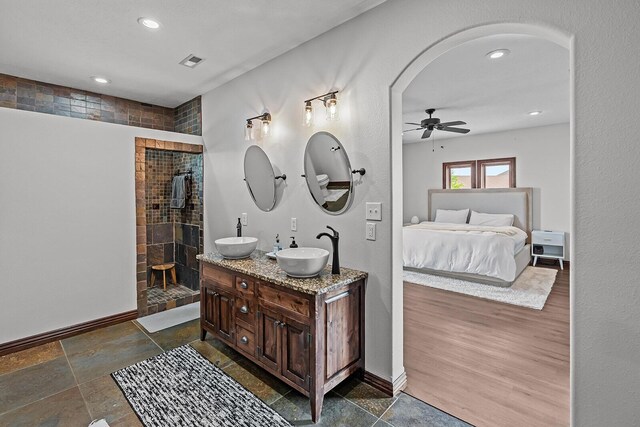 16326 Lawrence Unit 1232, Marionville, MO 65705 - ensuite bathroom featuring recessed lighting, baseboards, double vanity, a ceiling fan, and a tile shower