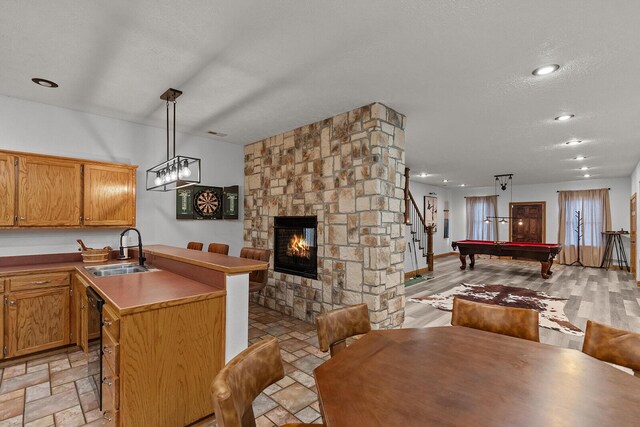 16326 Lawrence Unit 1232, Marionville, MO 65705 - kitchen featuring a sink, open floor plan, billiards table, a peninsula, and hanging light fixtures