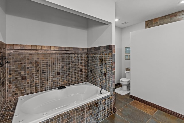 16326 Lawrence Unit 1232, Marionville, MO 65705 - bathroom featuring toilet, a jetted tub, tile walls, and baseboards