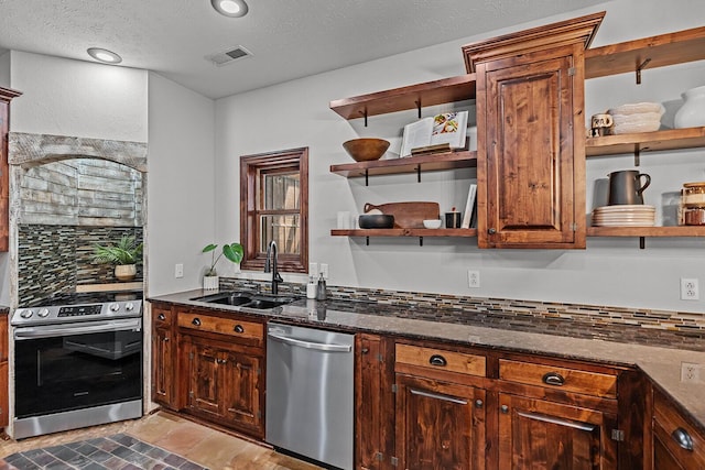 16326 Lawrence Unit 1232, Marionville, MO 65705 - kitchen with open shelves, appliances with stainless steel finishes, a sink, decorative backsplash, and dark stone counters