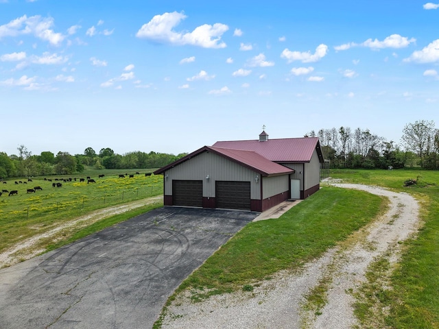 16326 Lawrence Unit 1232, Marionville, MO 65705 - detached garage with driveway and a view of rural / pastoral area