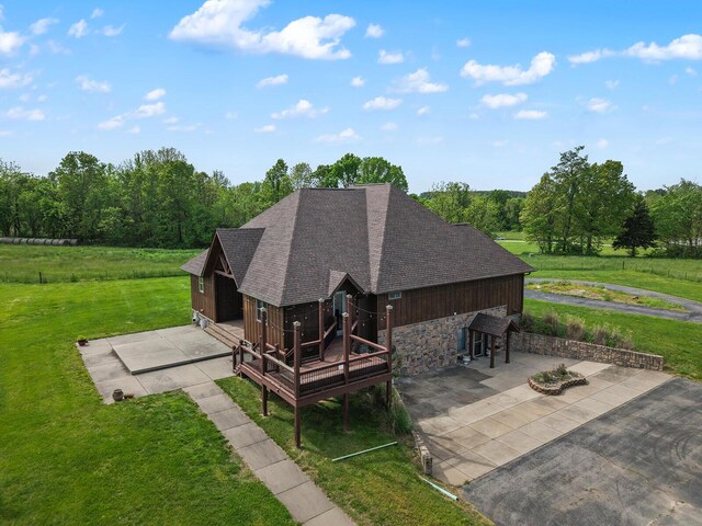 16326 Lawrence Unit 1232, Marionville, MO 65705 - back of property with a lawn, roof with shingles, stone siding, a deck, and a patio area