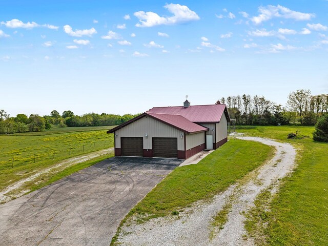 16326 Lawrence Unit 1232, Marionville, MO 65705 - view of home's exterior featuring an outdoor structure, driveway, and metal roof