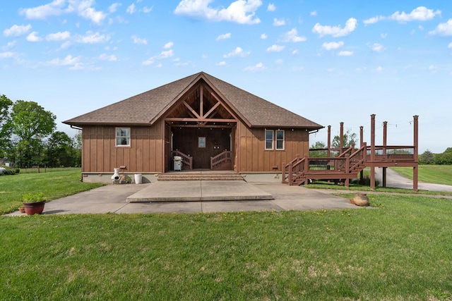 16326 Lawrence Unit 1232, Marionville, MO 65705 - back of house with a wooden deck, a yard, roof with shingles, and board and batten siding